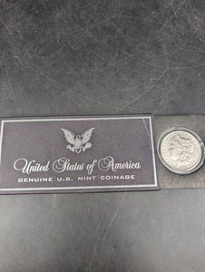 1884 Morgan Dollar in Protective Holder