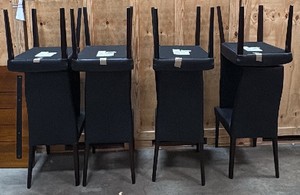 8 black chairs and large wooden table