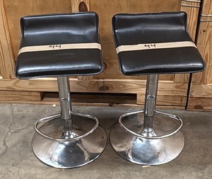 2 black and silver barstools
