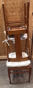 2 wooden chairs with cushions