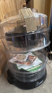 Boxes of kitchen supplies and infrared  oven