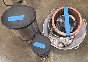 2 garbage cans and 4 planters