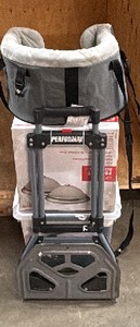 Small animal bed, ceiling fixtures, clear tote of clothes, small back dolly