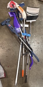 Asssortment of mops and brooms