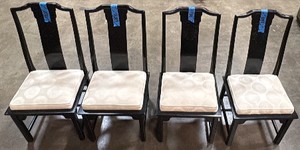 4 black chairs with cushions