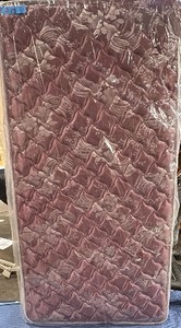 Purple twin mattress with floral design
