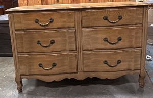 Vintage French Provincial 6-drawer double dresser featuring a serpentine front, cabriole legs, and ornate brass pull hardware