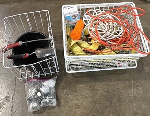 Baskets, extention cords, straps, garden tools, and a bag of lightbulbs