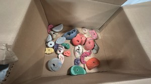 Box of rock climbing hand and foot holders