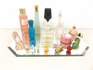 Mirrored Vanity filled with Perfume Bottles, Art Glass, Trinket Box, and Decorative Shoes