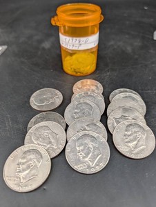 U.S. Eisenhower Dollar Coins with Labeled Container