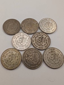 Lot of 8 Mexican Un Peso 10% Silver Coins