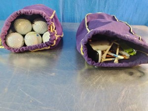 Purple velvet Crown Royal whiskey bags repurposed as DIY golf accessory pouches