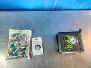 Slime Junior Tire Inflator (Model 40059) portable 12V air compressor along with a bag of multi-color LED valve stem caps