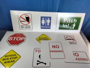 A collection of common community, safety, and traffic signs used for education