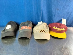 Four casual baseball caps and hats