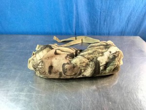 A camouflage-patterned hunting hand warmer