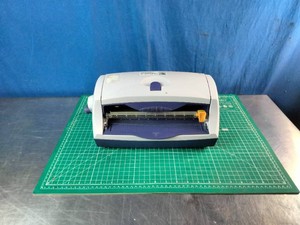 A Varitronics ProFinish Jr. Cold Laminating System and a  ZERRO Cutting Mat 18 x 24 (A2), a double-sided, 5-layer self-healing cutting board
