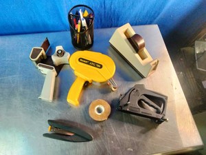 An assortment of office, framing, and crafting tools