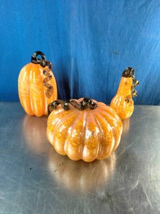 A set of hand-blown artisan glass pumpkins