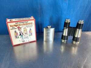 Jeff Foxworthys You Might Be a Redneck If... 2011 Calendar box, a silver stainless steel hip flask, and a pair of opera glasses binocular flask