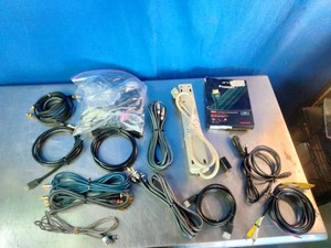 An assorted lot of electronic cables, adapters,