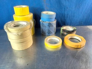 A collection of various 3M types of adhesive and masking tapes