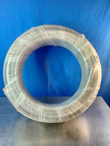 A coiled gray industrial or electrical cable