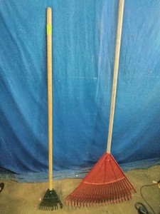 A set of lawn and leaf rakes