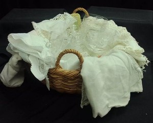 BASKET FULL OF VINTAGE ETCHED GLASSES AND LOTS OF VINTAGE DISH TOWELS