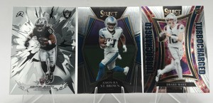 Lot Of 3 NFL Rookie Cards Including 2026 Topps Resurgence Ashton Jeanty RC #149, 2021 Panini Select Amon-Ra St. Brown RC #173, And 2024 Panini Select Turbocharged Drake Maye RC #24