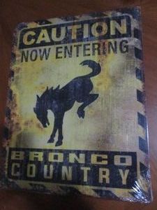 Ford Bronco with authenticity sticker metal sign measures 12 x 14 inches