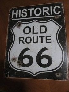 Route 66 metal sign measures 12 x 14 inches