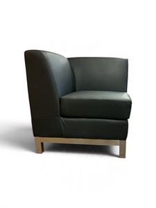 black modular corner lounge chair with an upholstered back and seat, set on a metal leg frame