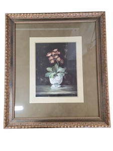 framed, vertical still life painting depicting a potted flowering plant.