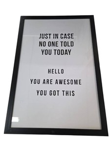 framed motivational sign