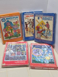 vintage video games in their boxes lot