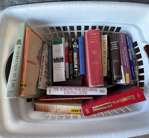 laundry basket, full of books