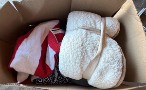 Box of blankets and towels