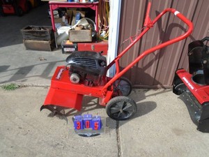 Earthquake front tine roto tiller 4 cycle. Used. Tested & works. As shown.