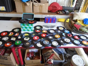 Group of 50 45 rpm records with case. As shown.