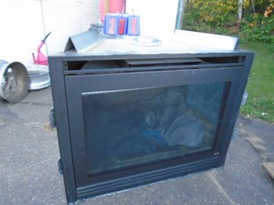 Natural gas fireplace insert. Store display. Unused. 57 x 44 x 25. As shown.