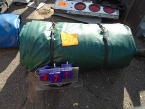 Green heavy truck tarp. Used condition. See picture for size. As shown.