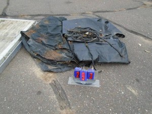 Misc tarps with bungees. As shown.