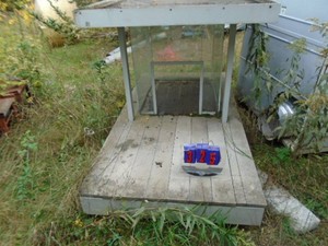 Aluminum & plastic dog house. Very fancy. As shown.