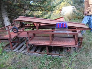 Drive on full length car ramps. 12 inches high. Can be disassembled to store. As shown.