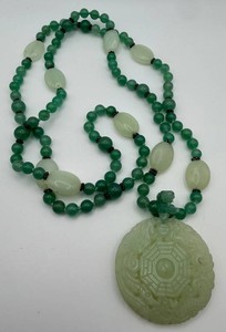 Green Beaded Necklace With Carved Circular Pendant