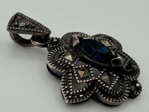 Sterling Ornate Floral Pendant With Faceted Blue Stone