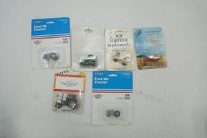 NIP Ertl 164 die cast metal tractors and implements