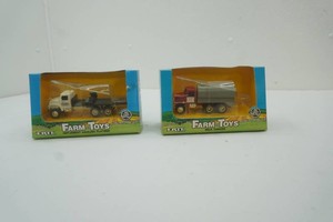 NIP Ertl Farm Toys 164 scale die cast metal Milk Tanker, Implement Hauling Flatbed